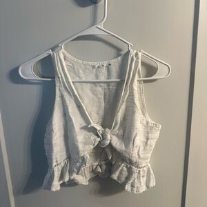 White Sleeveless Crop Tank Top with Plunge Neckline and Ruffled Hem